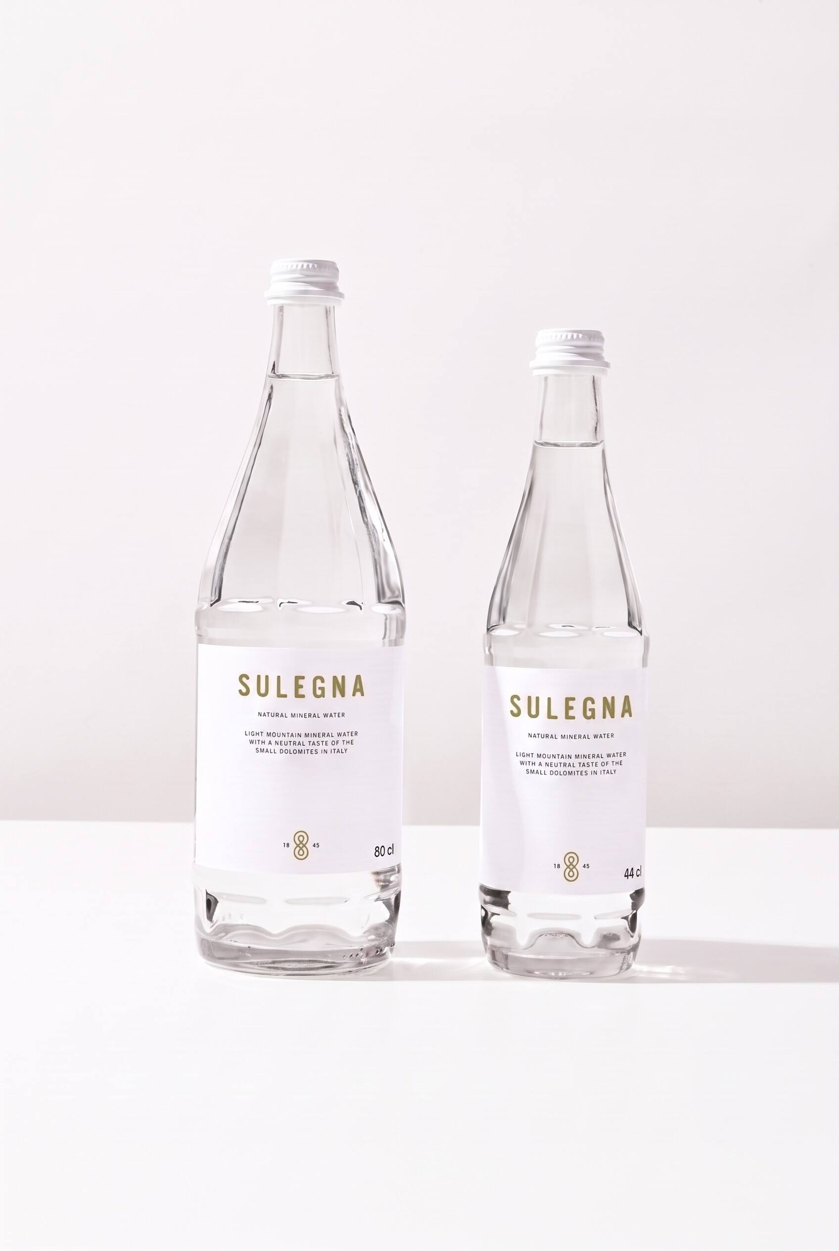 SULEGNA Natural bottles, 80 cl and 44 cl, side by side on white