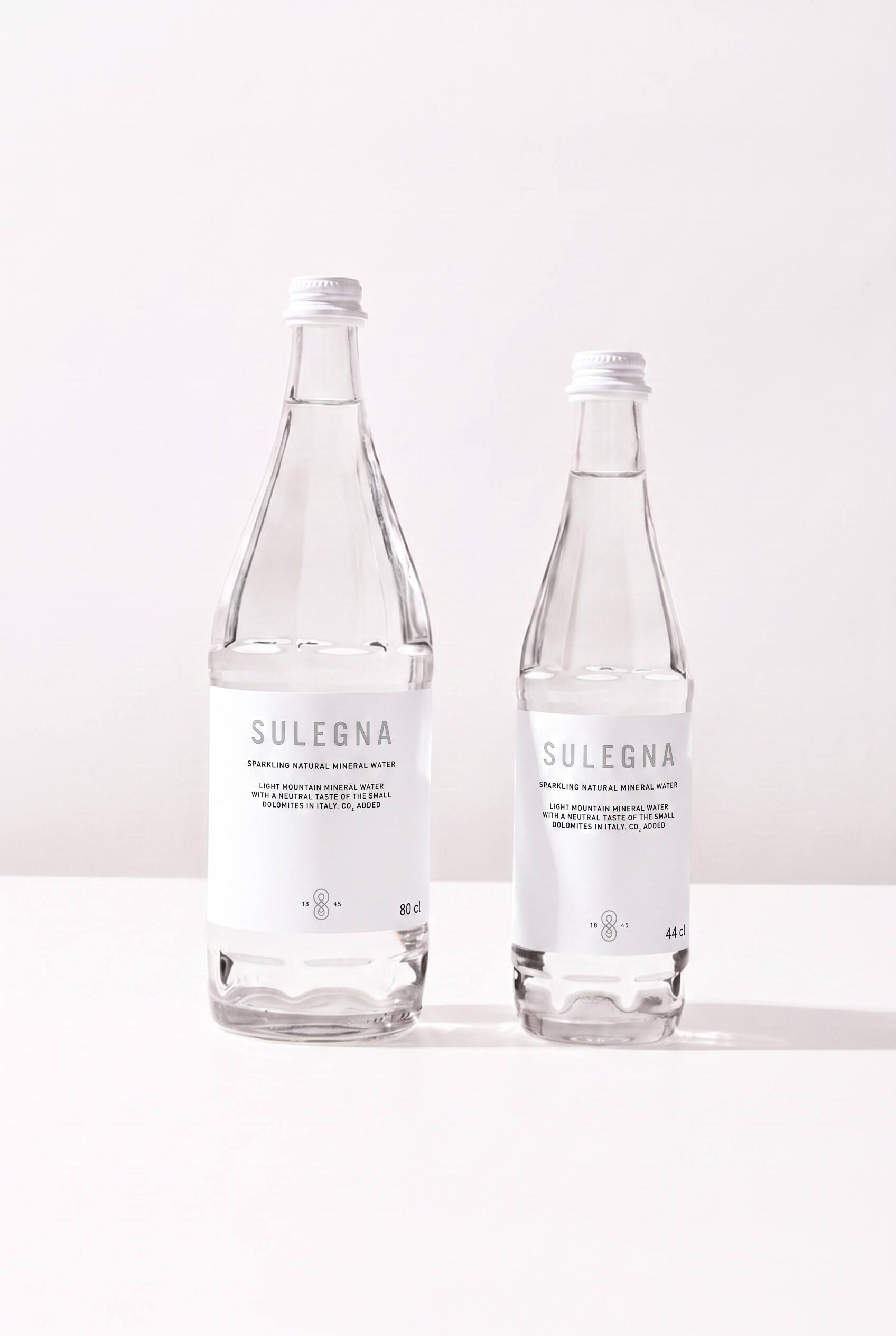 SULEGNA Sparkling bottles, 80 cl and 44 cl, side by side on white